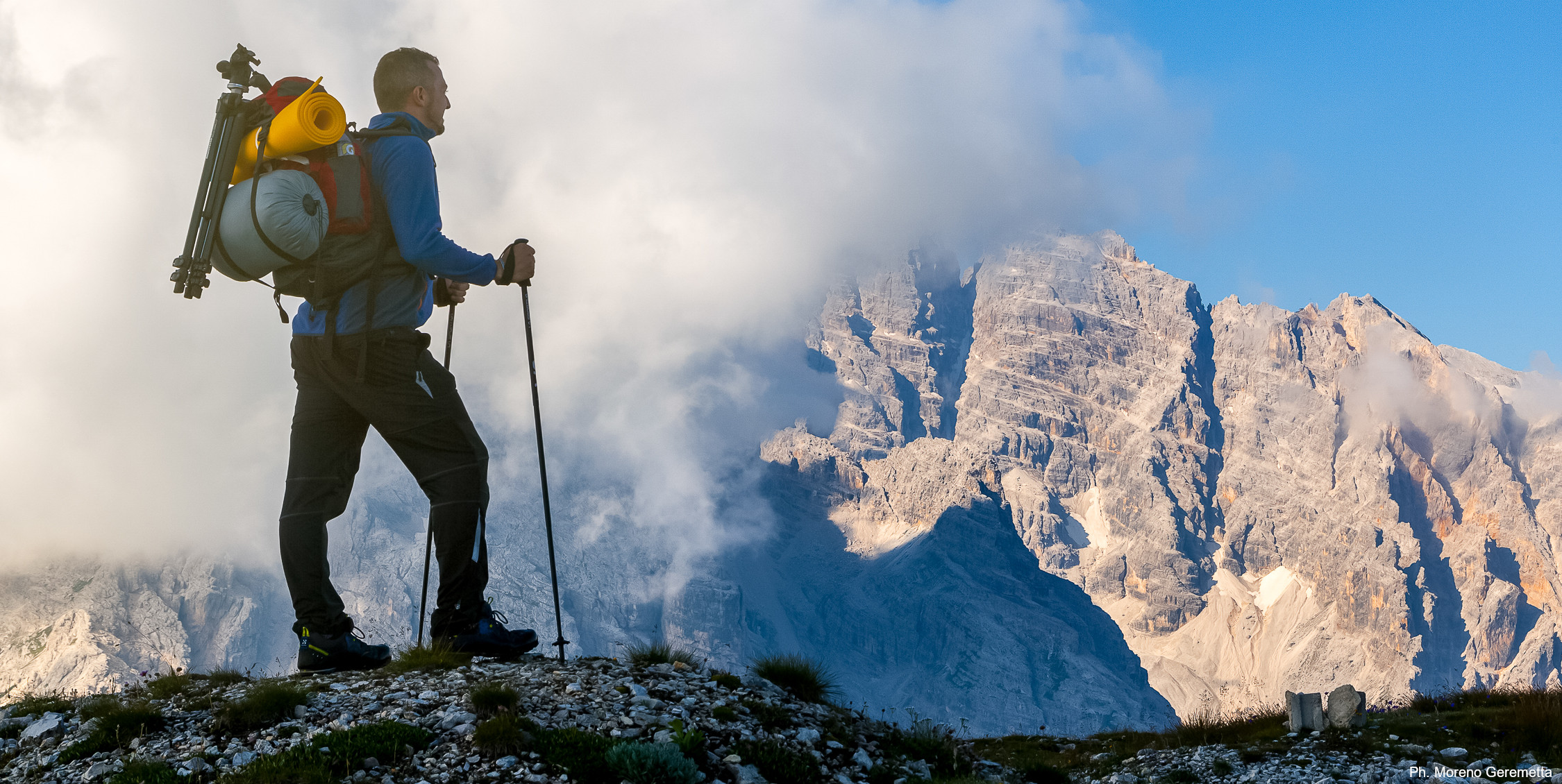 Dolomiti UNESCO feed. Pictured: a hiker in front of Monte Cristallo